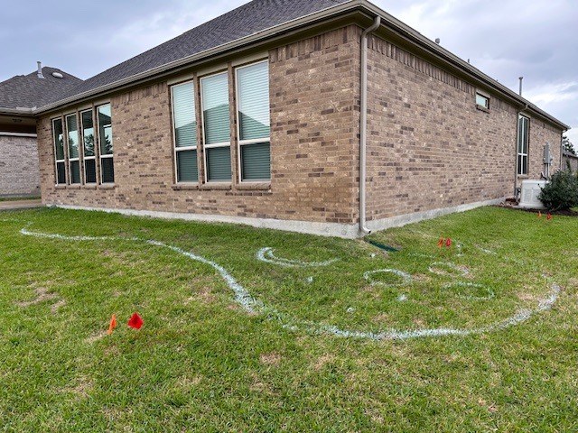 Front-yard xeriscape conversion in Conroe, TX — before