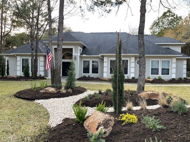 Front-Yard River Rock Planted Beds XII in Magnolia, TX