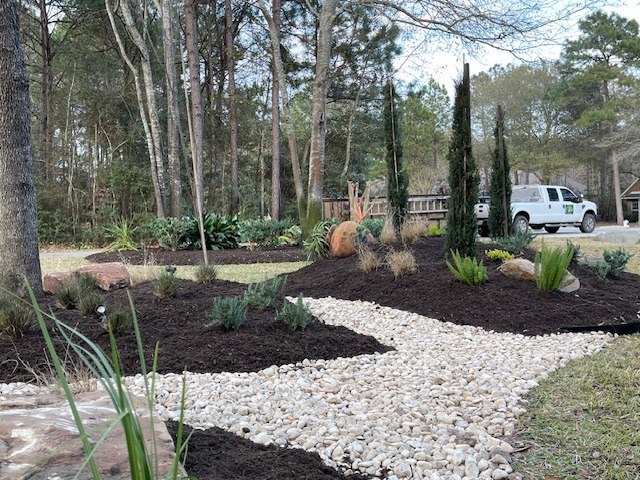 River rock beds and set boulders in Magnolia, TX — after