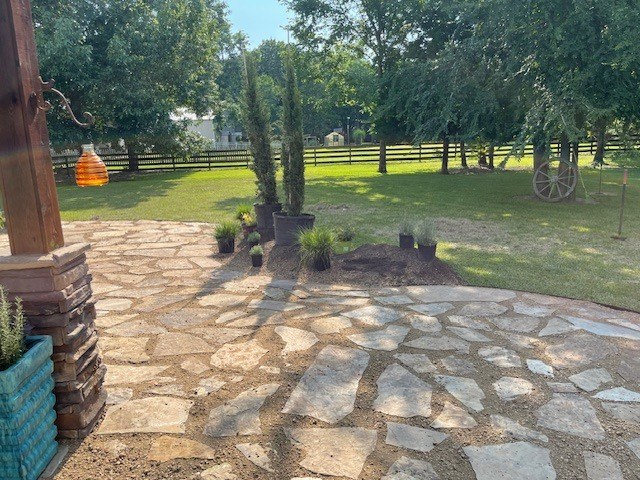 Flagstone patio and fire pit in Hill Country — after