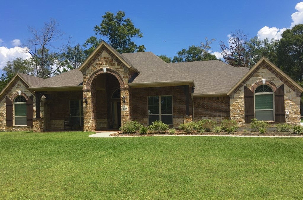 Front-yard planted beds in Conroe, TX — before