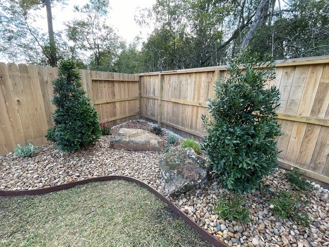 Xeriscape with boulders and rock base in Montgomery County — after